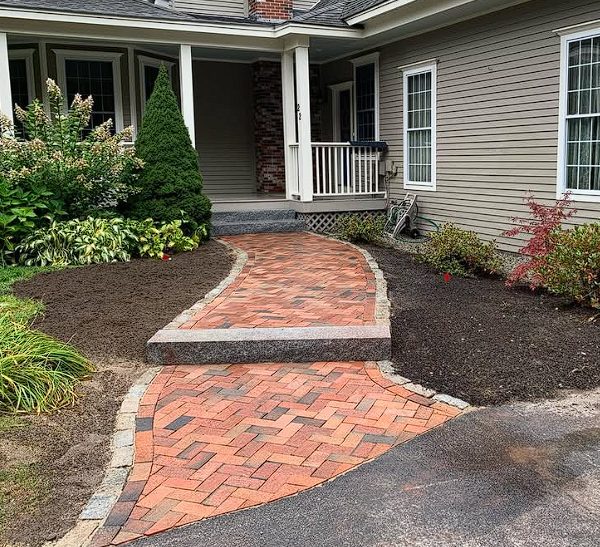 Natural stone retaining wall construction
