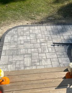 Outdoor firepit and seating wall installation